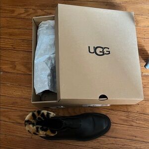 UGG Black Leather Slip-On Boot with Leopard-Print Fur Collar.